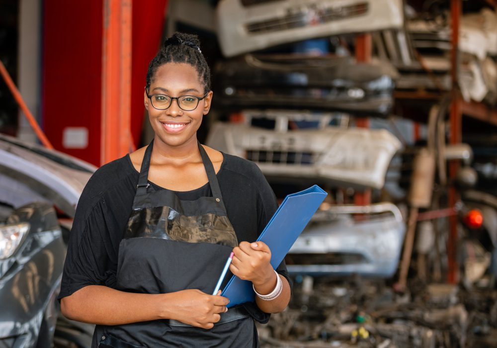 African american worker woman wear spectacles crossed arms holding clipboard standing.